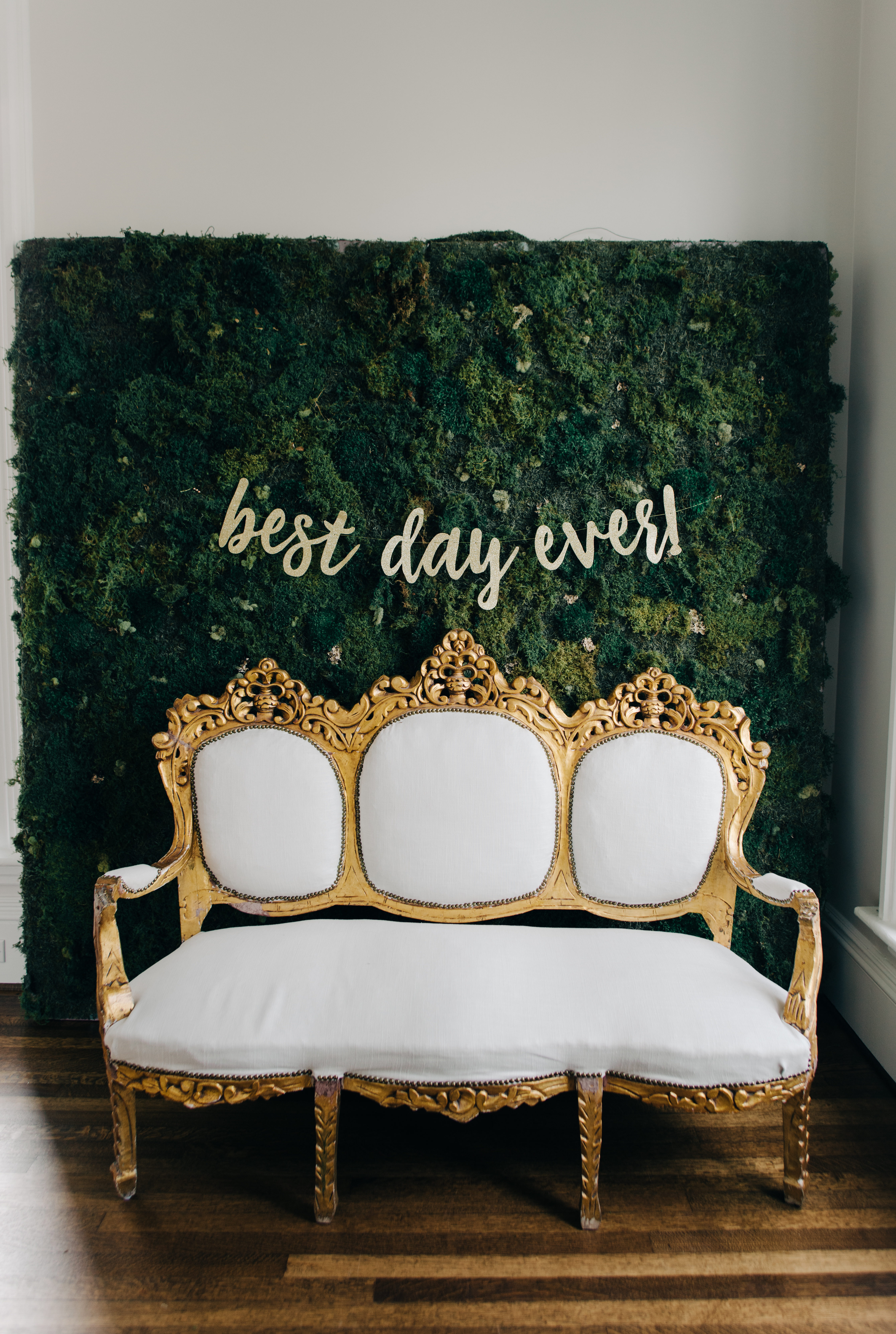 Moss wall and vintage sofa at wedding venue McAlister-Leftwich House | Greensboro, NC