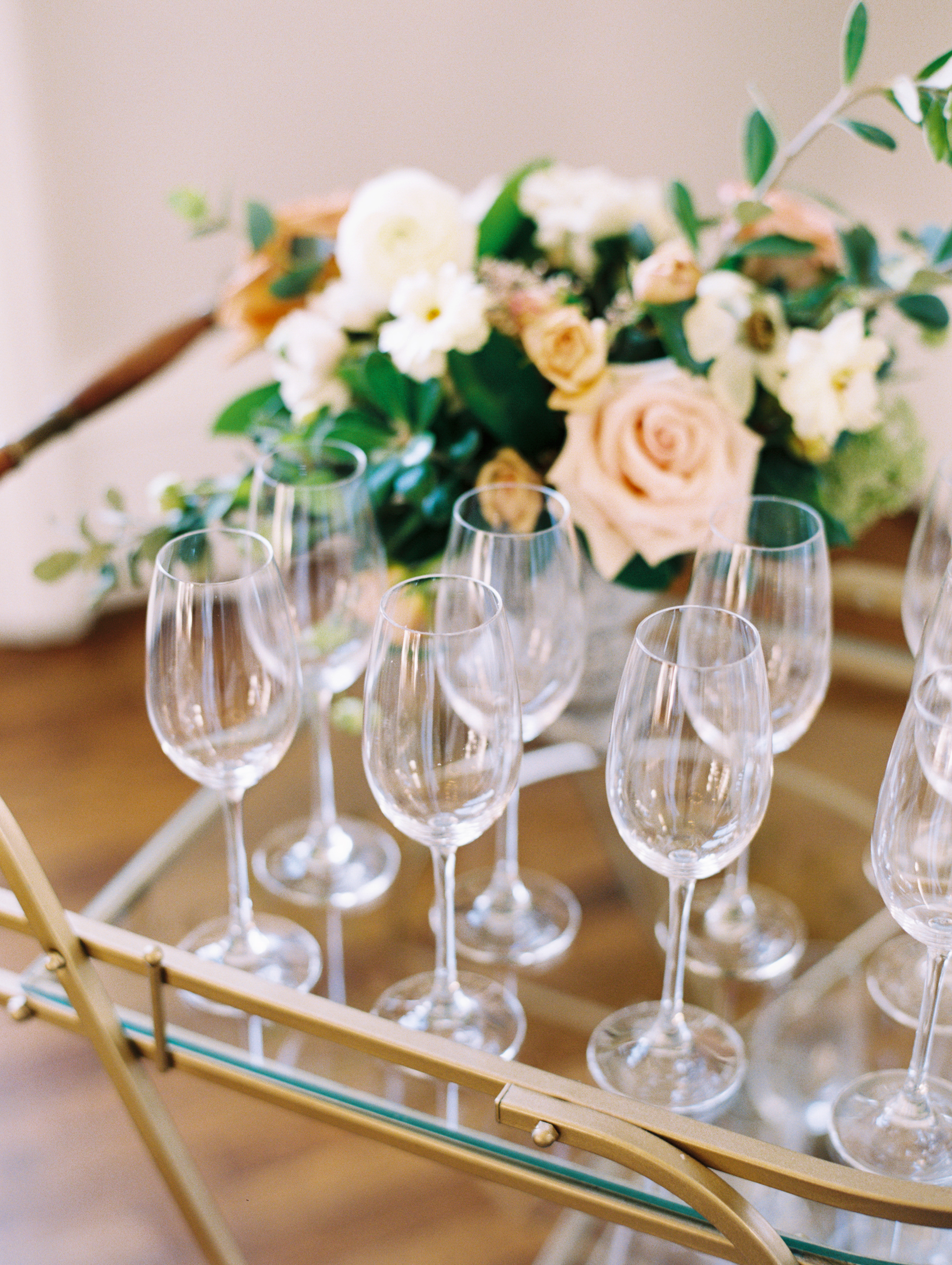 Glassware on bar cart for mimosa bar | Historic wedding and event venue: McAlister-Leftwich House in Greensboro, NC